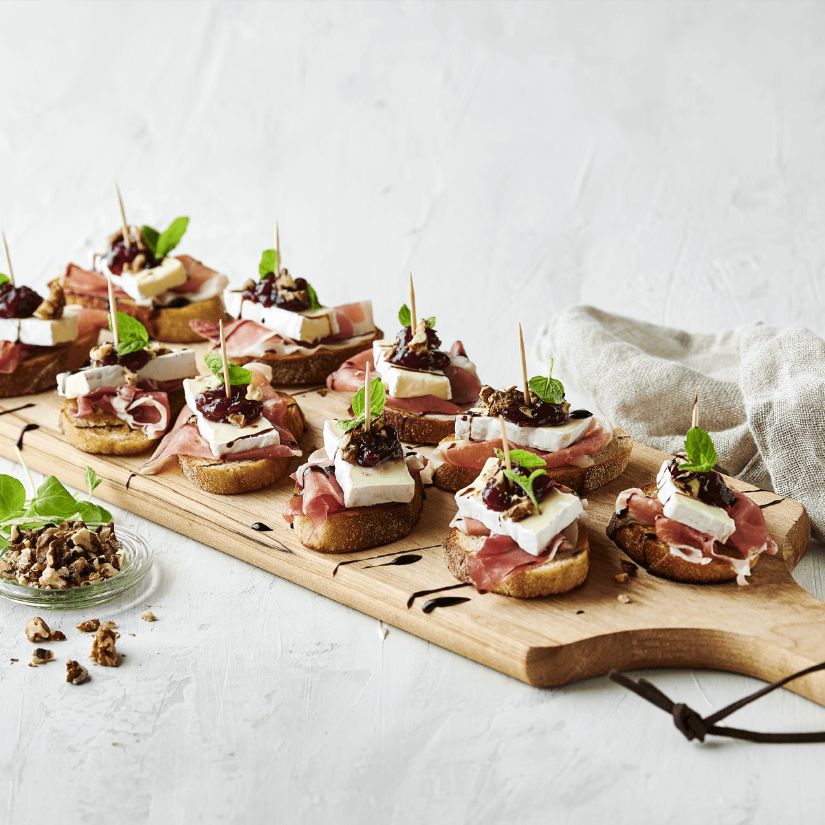 Brie, Cranberry and Prosciutto Crostini with Balsamic Glaze - Emborg Philippines