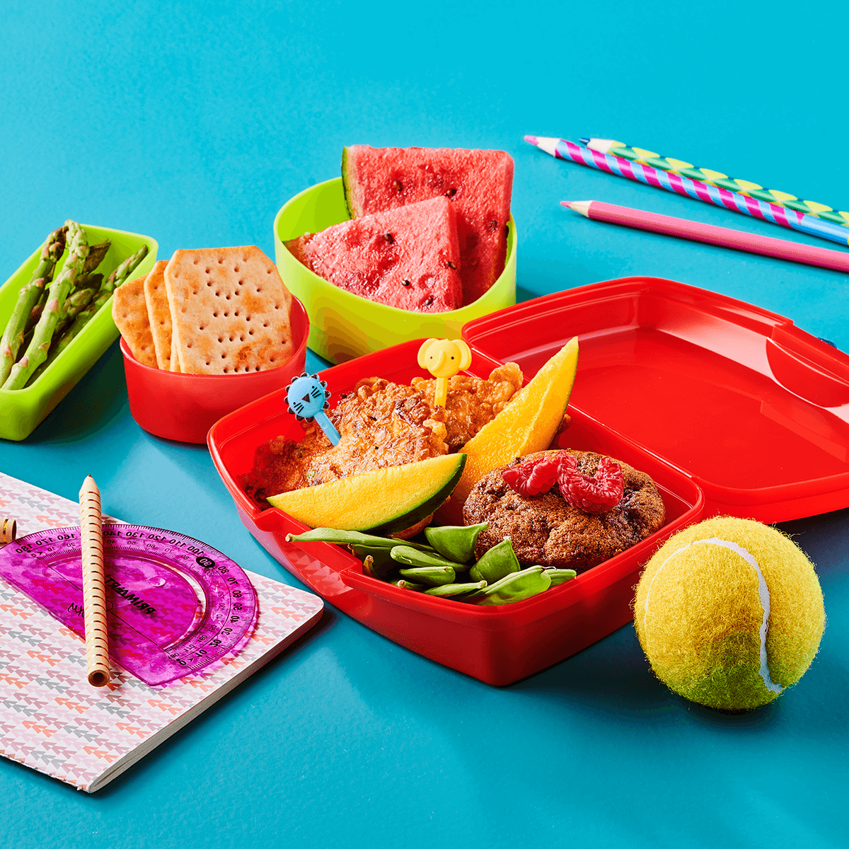 Lunch Box with Veggie Fritters, Raspberry Muffin and Snacks - Emborg 