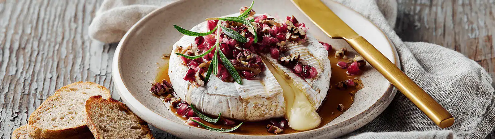 Baked Brie with Nuts, Pomegranate and Honey - Emborg