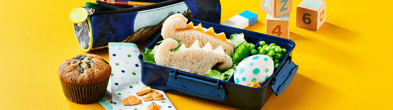 Dino Lunch Box with Blueberry Muffin - Emborg