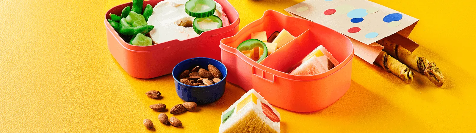 Lunch Box with Cream Cheese Bagel, Japanese Fruit Sandwich and Pesto Swirls - Emborg