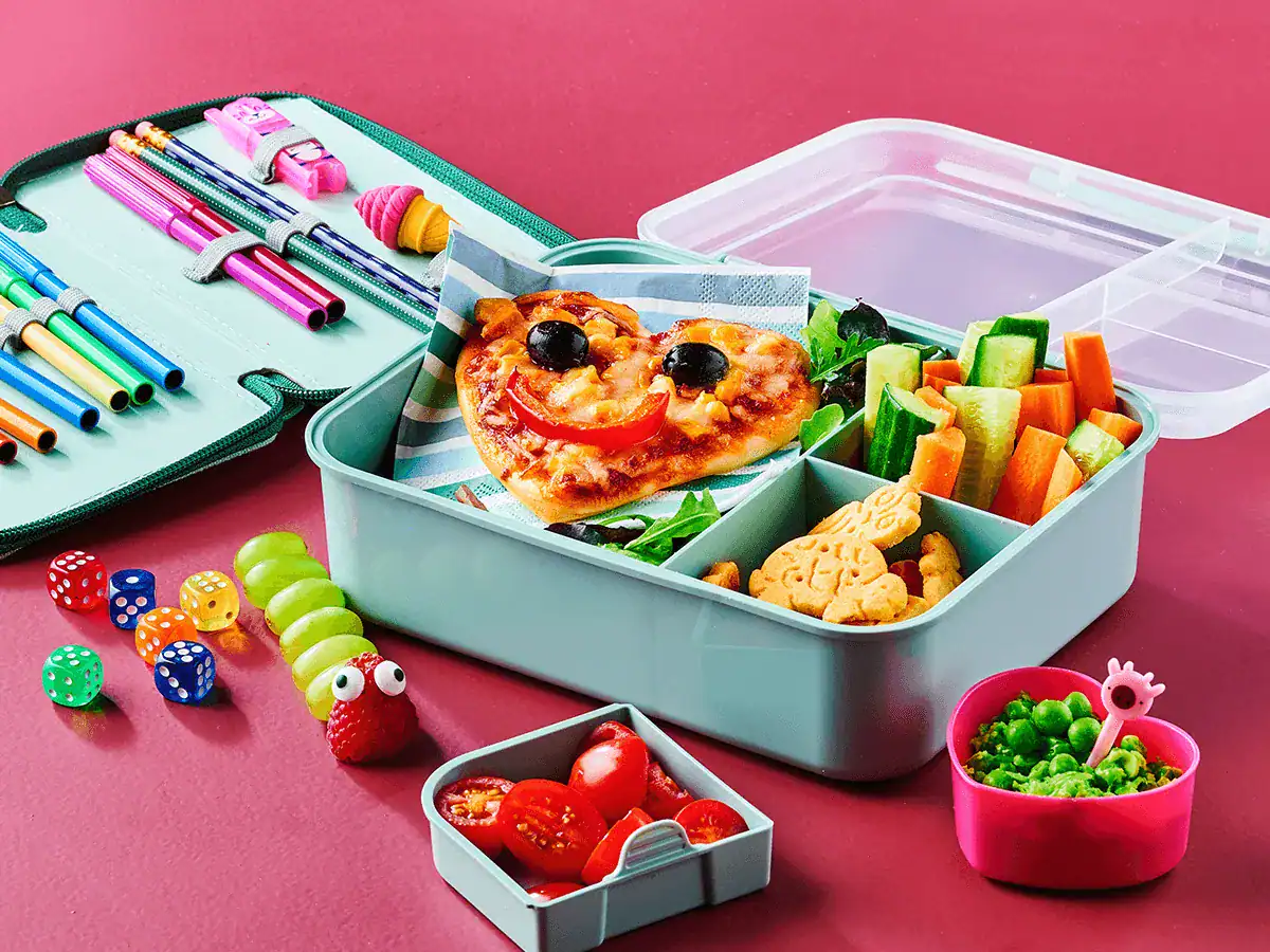 Lunch Box with Mini Pizzas, Veggie Snacks and Mashed Peas - Emborg Singapore
