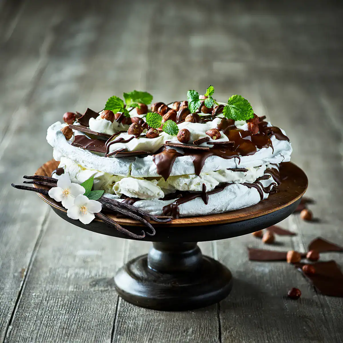 Hazelnut Meringue Layer Cake with Chocolate Drizzle - Emborg 