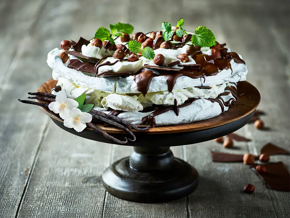 Hazelnut Meringue Layer Cake with Chocolate Drizzle - Emborg 
